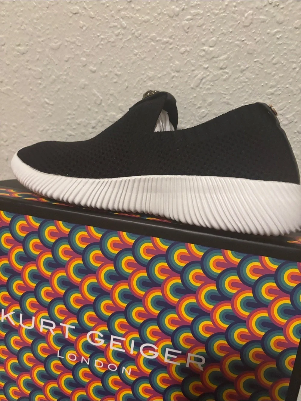 Kurt Geiger Black Knit Slip-On Sneakers with Gold Emblem